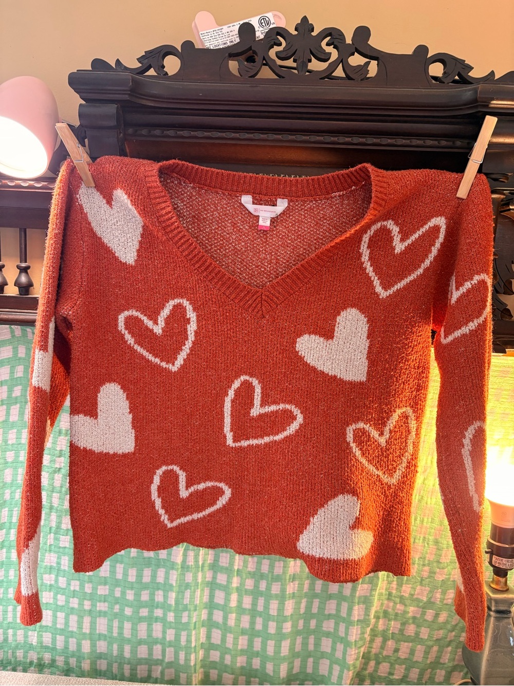 No Boundaries Rust V-Neck Sweater with White Heart Print.  Ladies medium